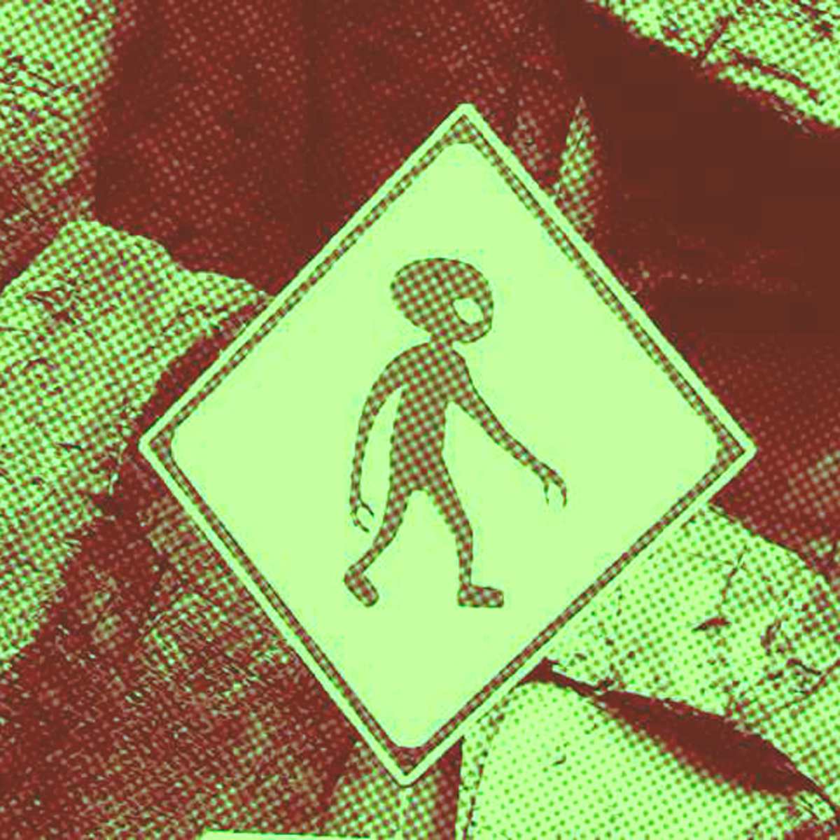 placa de trânsito indicando extraterrestre